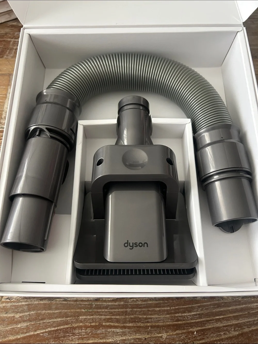 Pet grooming kit by Dyson-engineered to groom medium and long-haired pets.